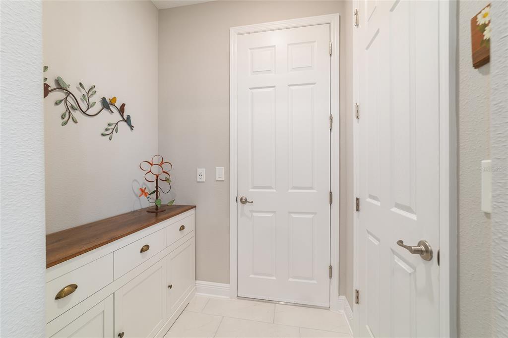 9681 Southwest 82nd Street Road Ocala, FL 34481 - Photo 34 of 62 a bathroom with a granite countertop sink and a mirror