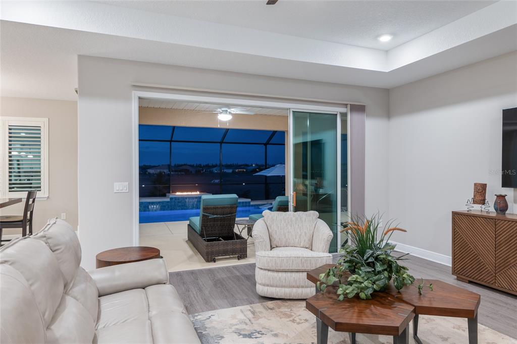 9681 Southwest 82nd Street Road Ocala, FL 34481 - Photo 49 of 62 a living room with furniture and a potted plant