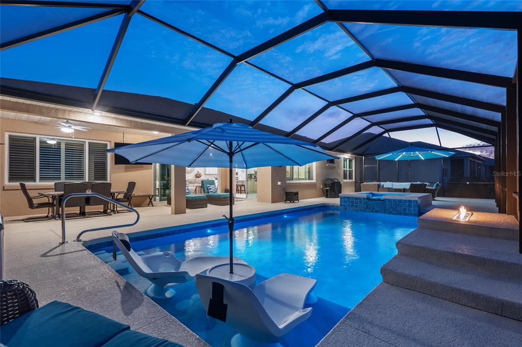 9681 Southwest 82nd Street Road Ocala, FL 34481 - Photo 50 of 62 a view of a swimming pool with seating space