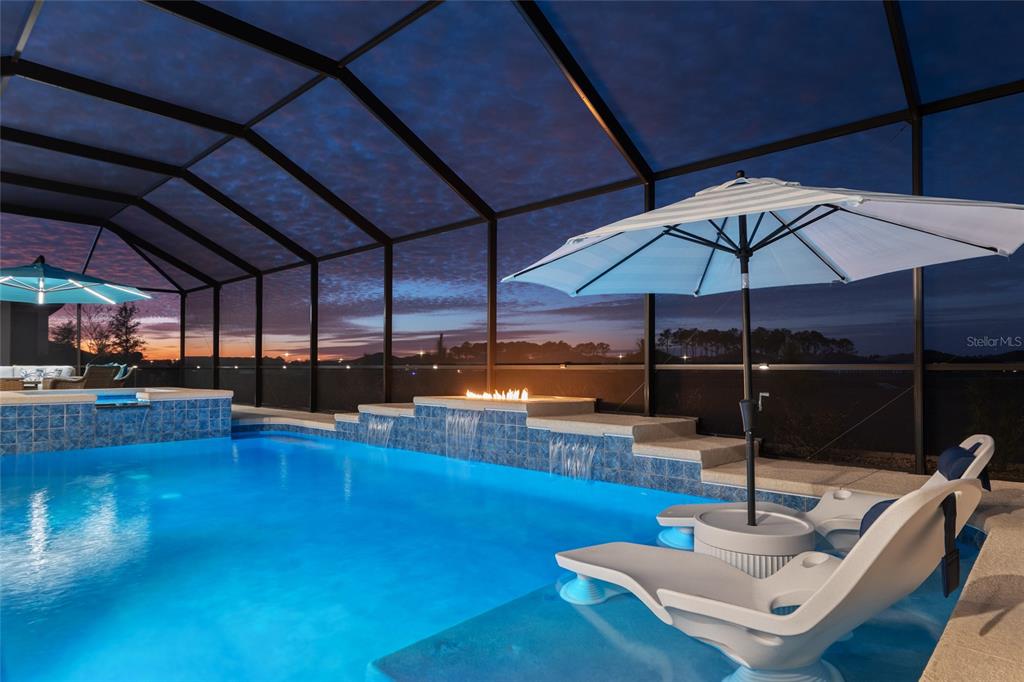 9681 Southwest 82nd Street Road Ocala, FL 34481 - Photo 53 of 62 a living room with patio furniture and a wooden floor