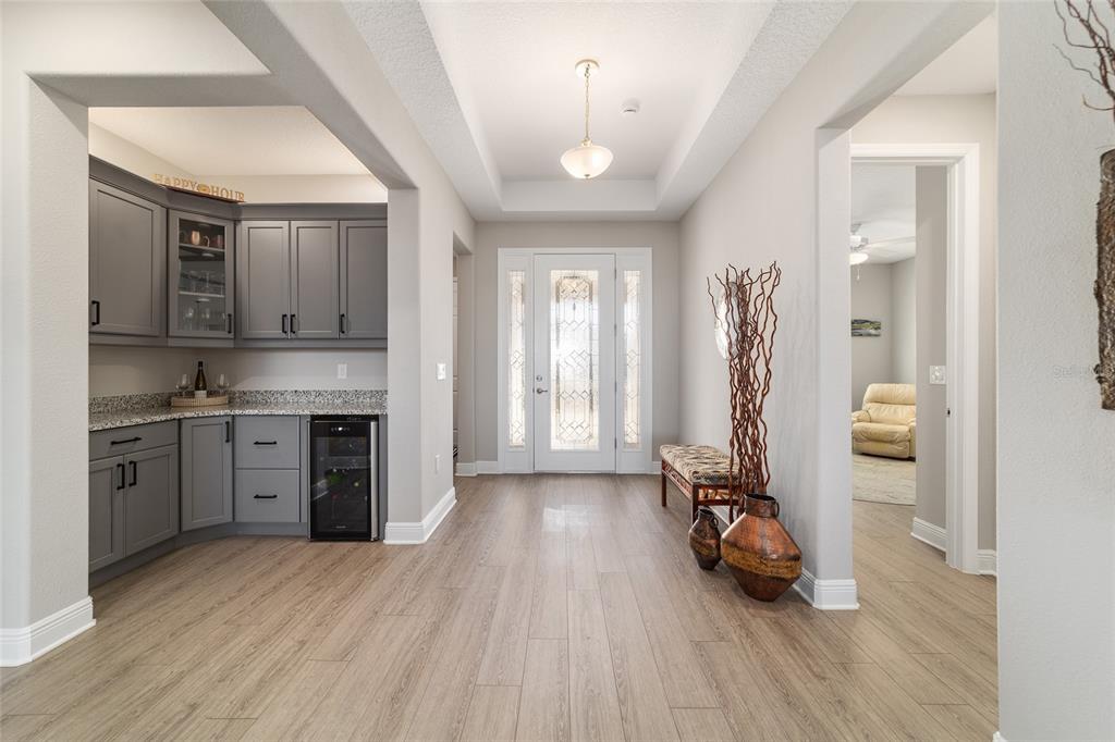 9681 Southwest 82nd Street Road Ocala, FL 34481 - Photo 8 of 62 a view of a kitchen with a sink and a refrigerator