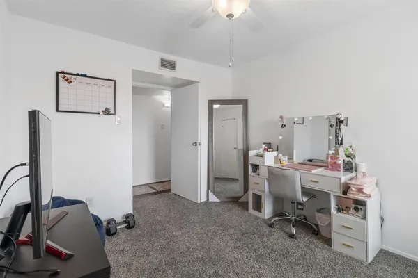 a view of a workspace with furniture
