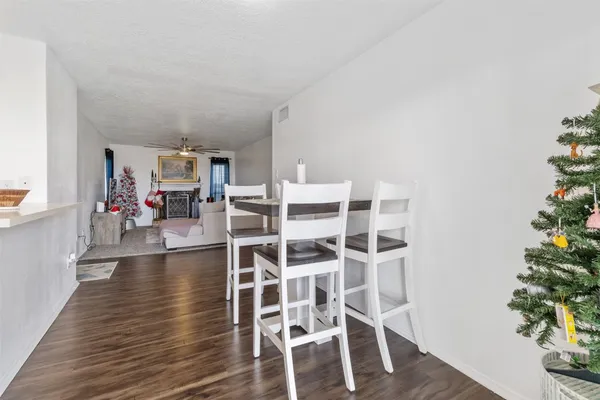 a view of a livingroom with furniture wooden floor and a rug