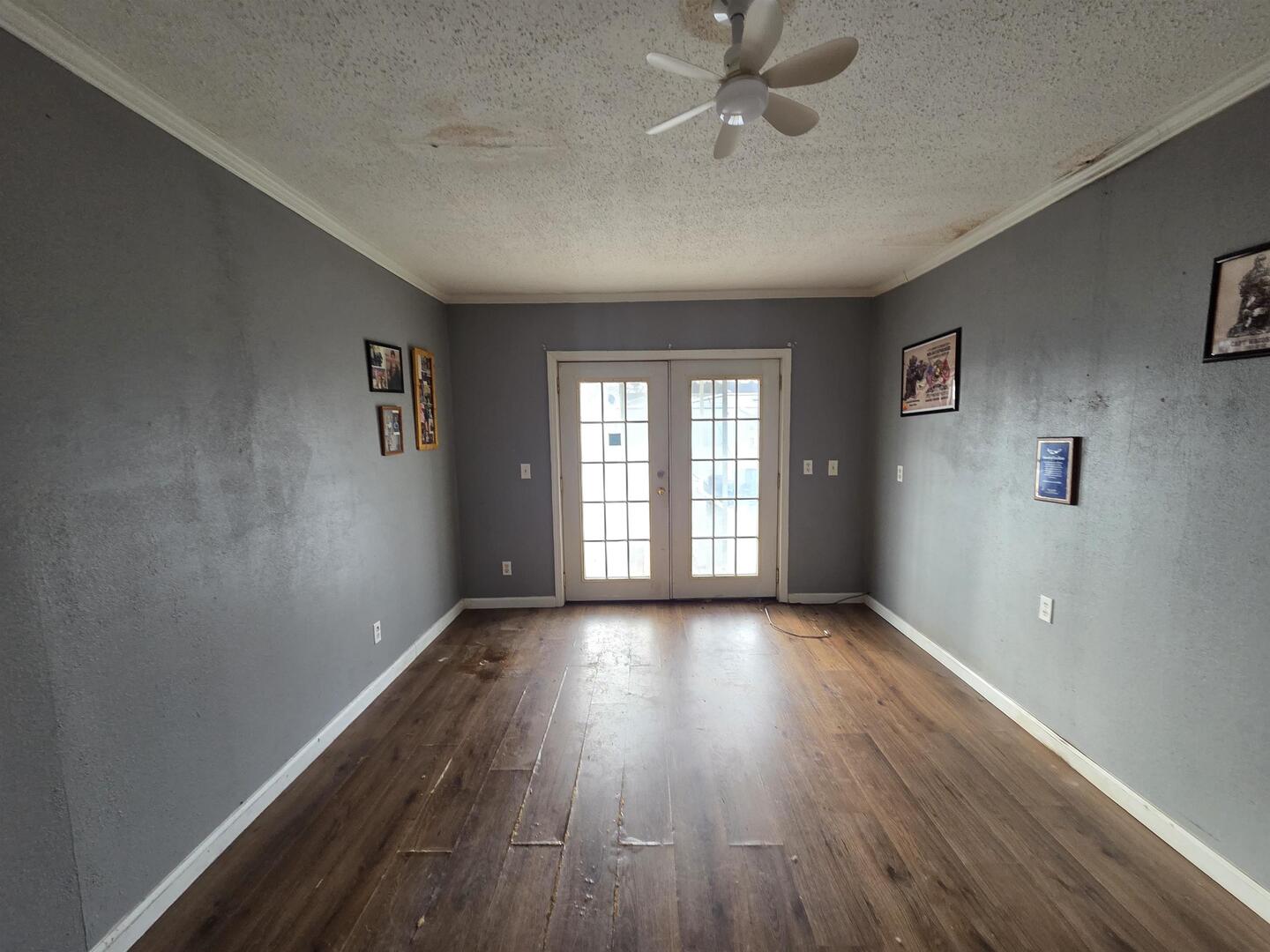 710 South Main Street Harrisburg, IL 62946 - Photo 14 of 18 a view of an empty room with wooden floor and a window