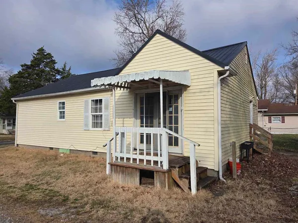 a view of house with a roof deck