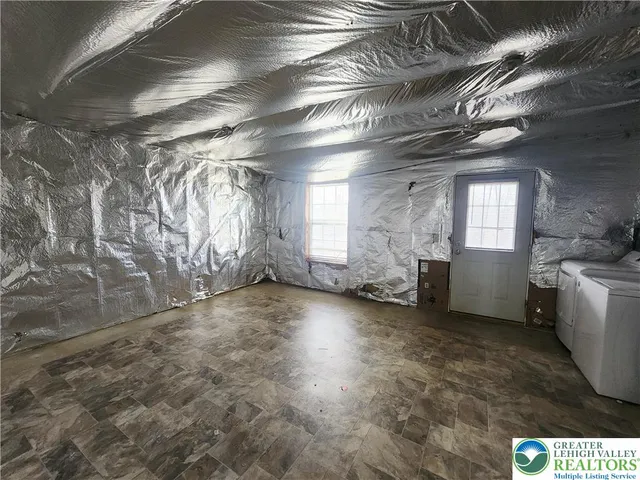 a view of a hallway with stairs