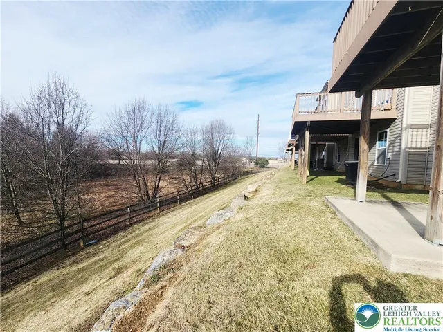 a view of a backyard of the house