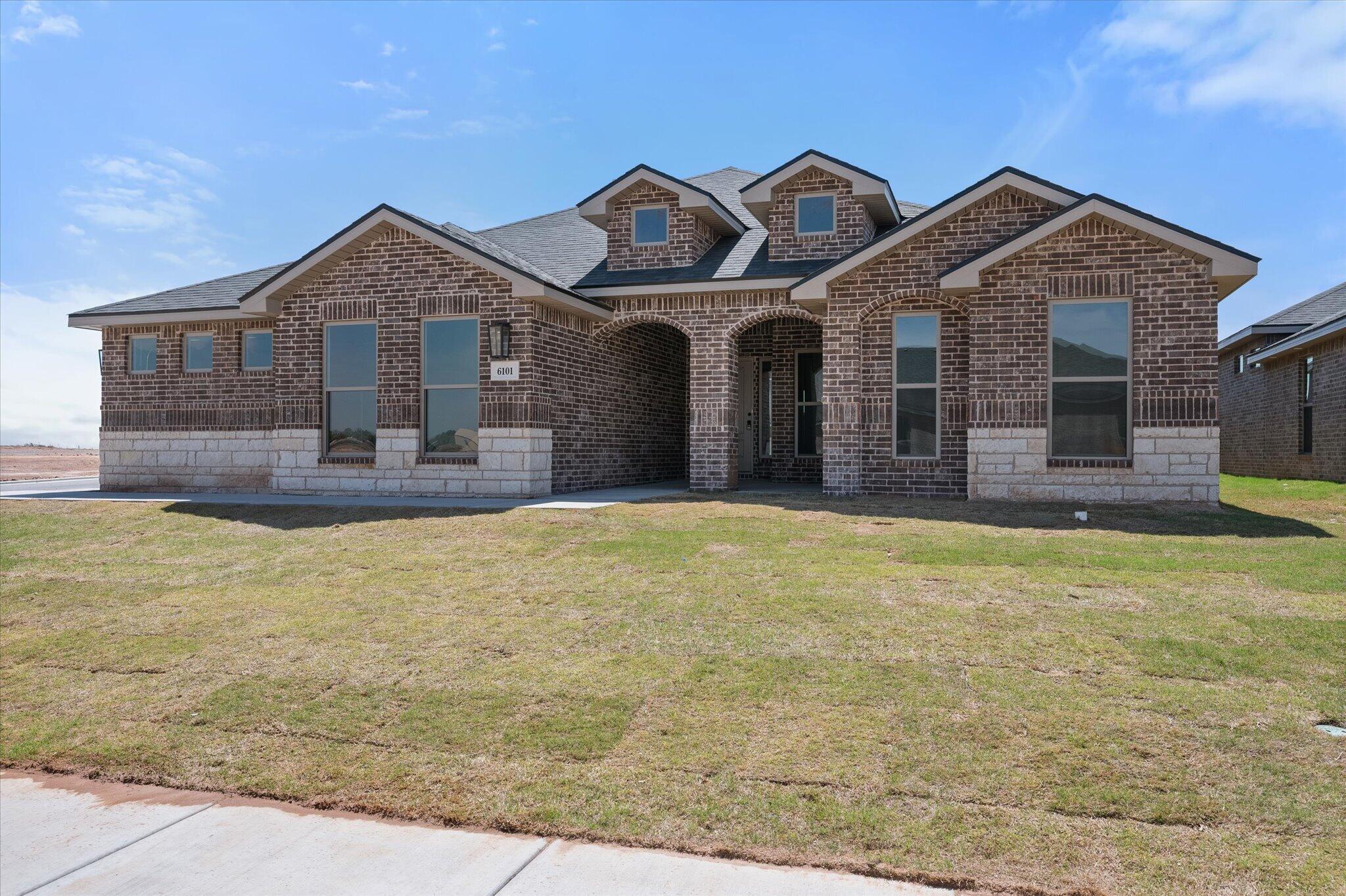 6101 121st Street Lubbock, TX 79424 - Photo 1 of 29 a front view of a house with a yard