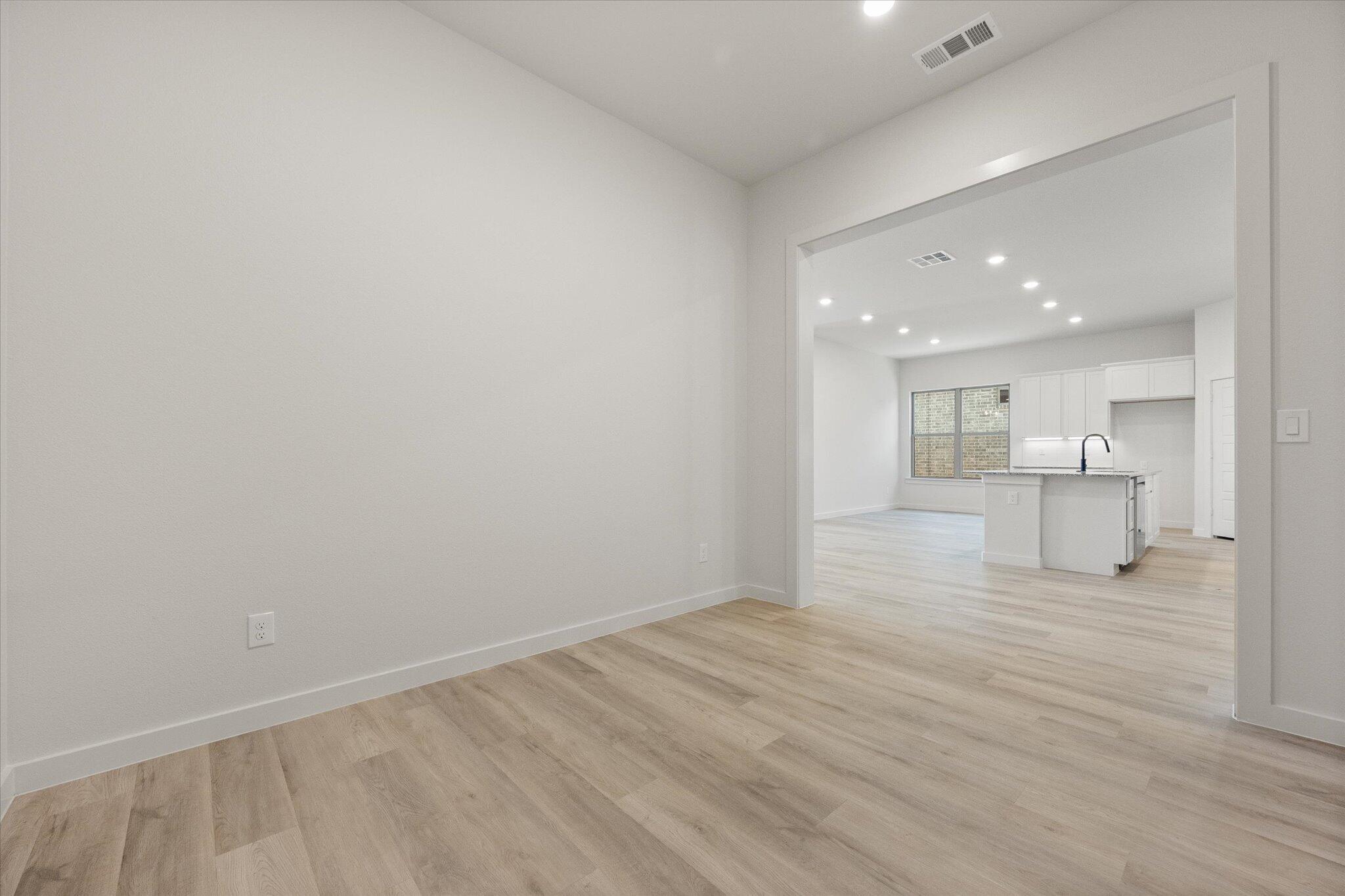 6101 121st Street Lubbock, TX 79424 - Photo 14 of 29 a view of a kitchen with wooden floor