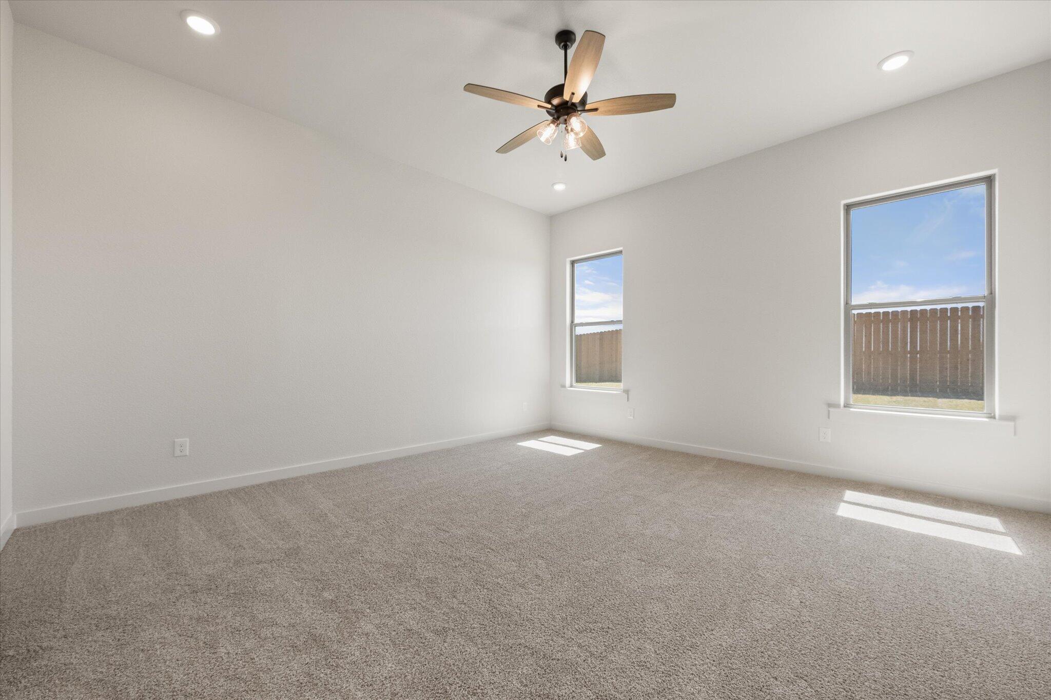 6101 121st Street Lubbock, TX 79424 - Photo 16 of 29 a view of an empty room with a window