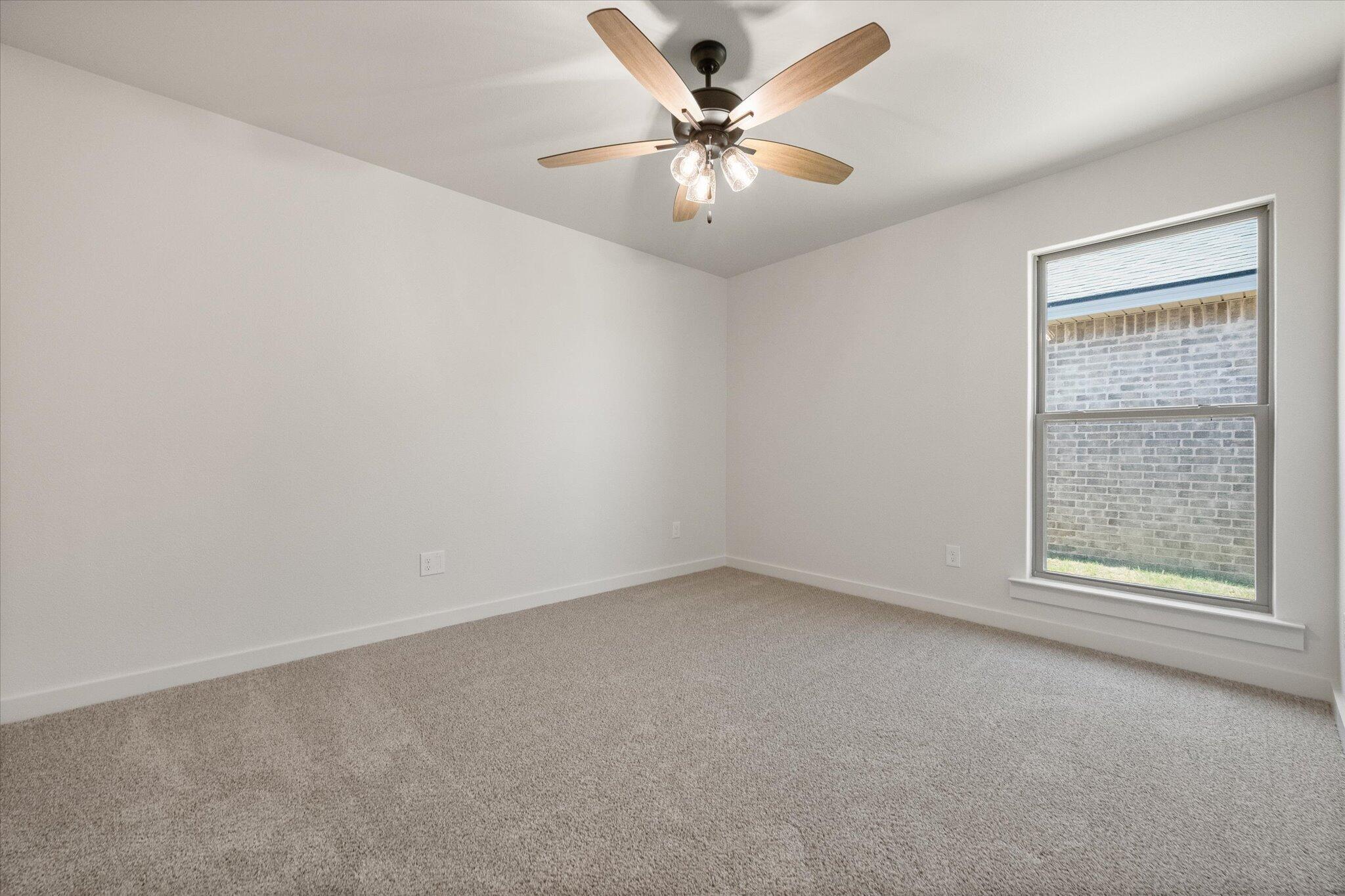 6101 121st Street Lubbock, TX 79424 - Photo 22 of 29 an empty room with a window