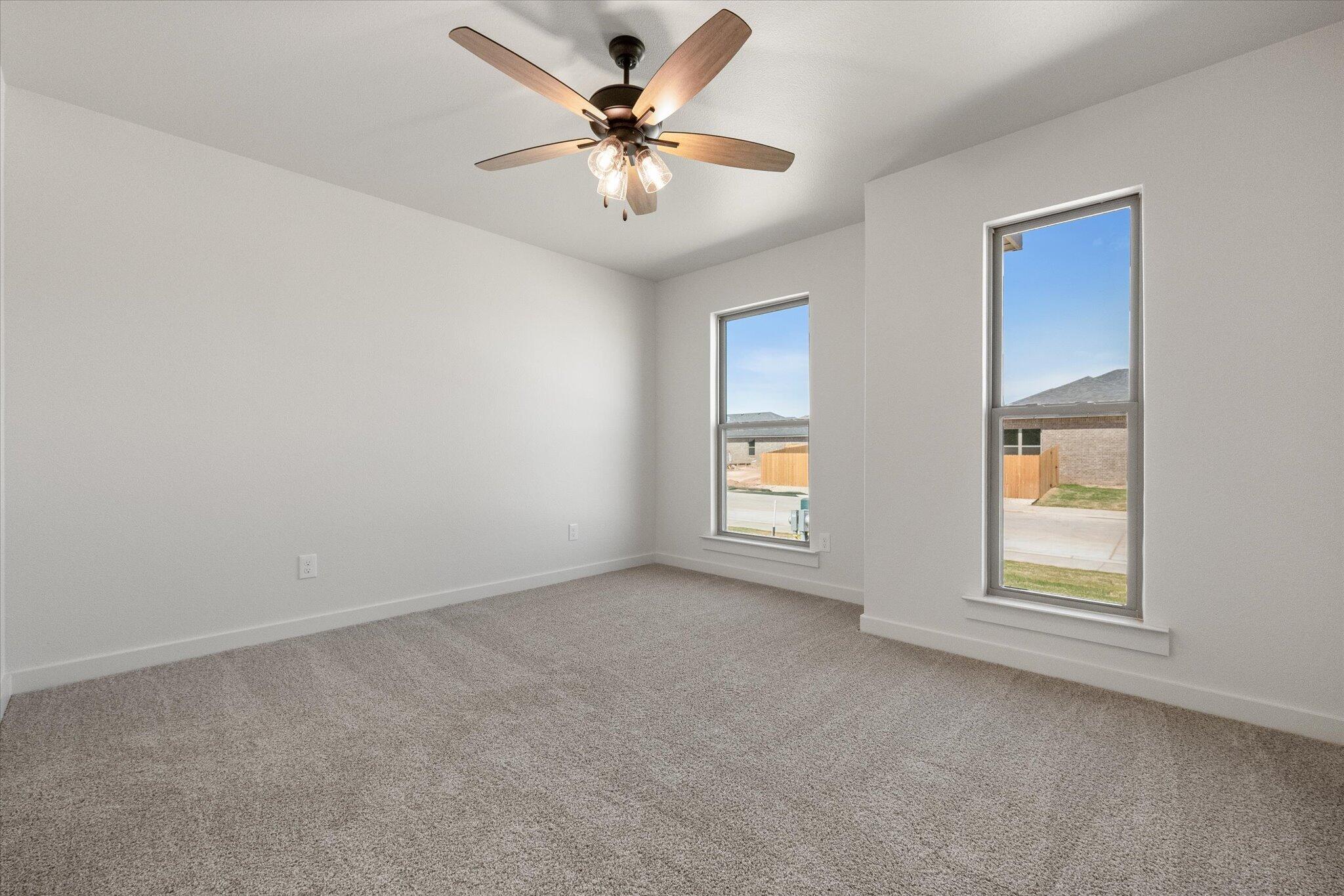 6101 121st Street Lubbock, TX 79424 - Photo 23 of 29 an empty room with windows and fan