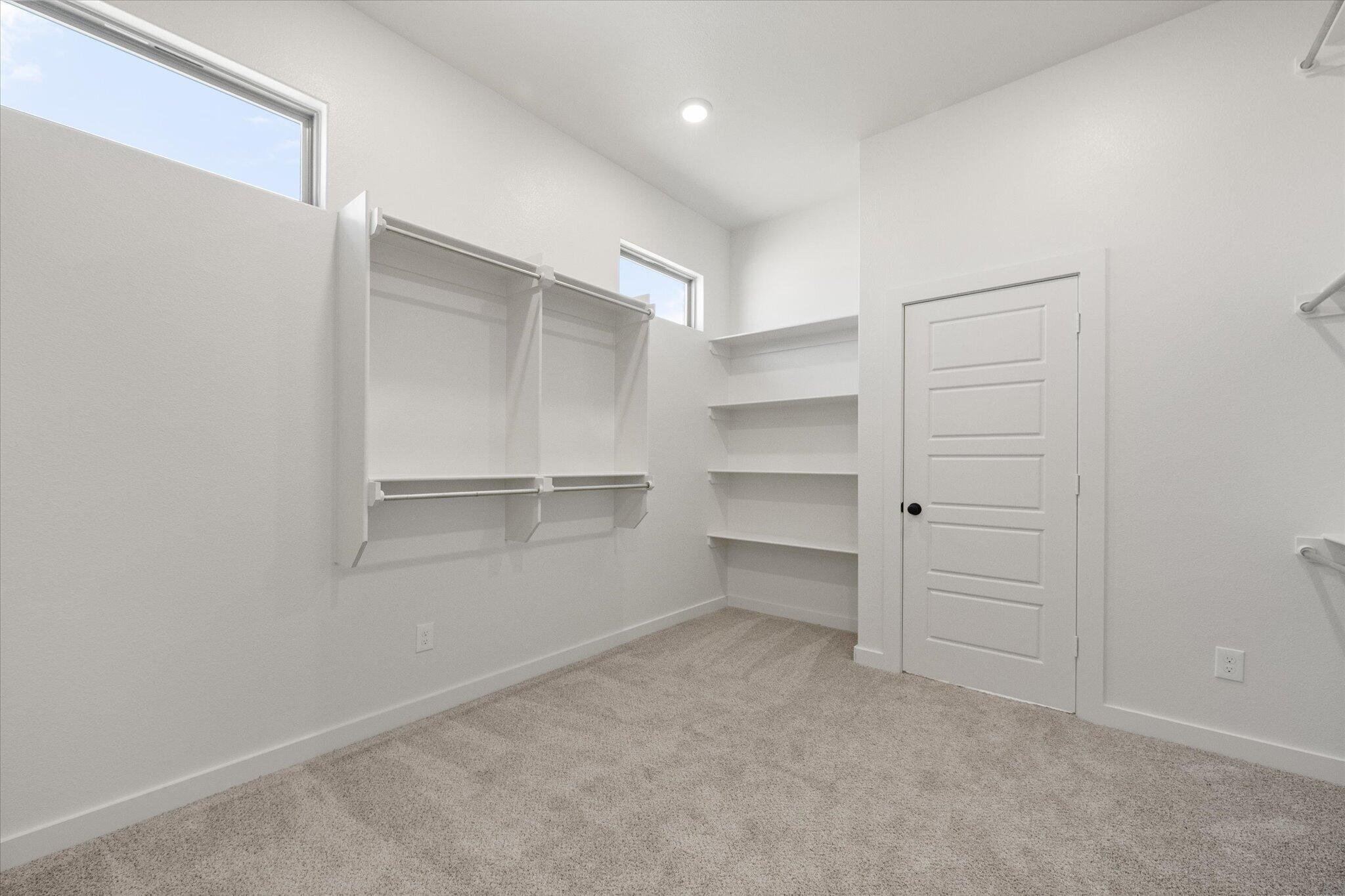 6101 121st Street Lubbock, TX 79424 - Photo 26 of 29 a view of walk in closet with empty racks