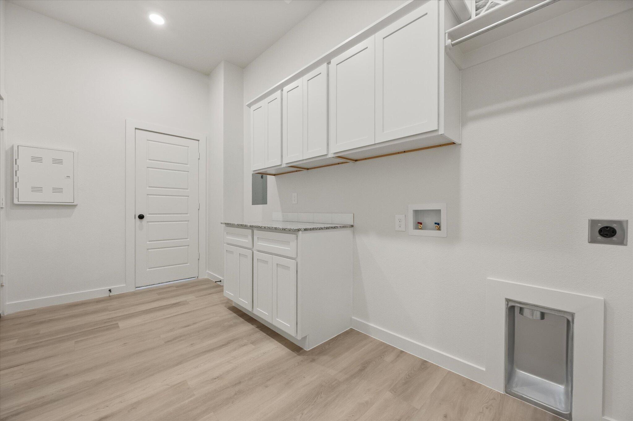 6101 121st Street Lubbock, TX 79424 - Photo 27 of 29 a view of cabinets and wooden floor
