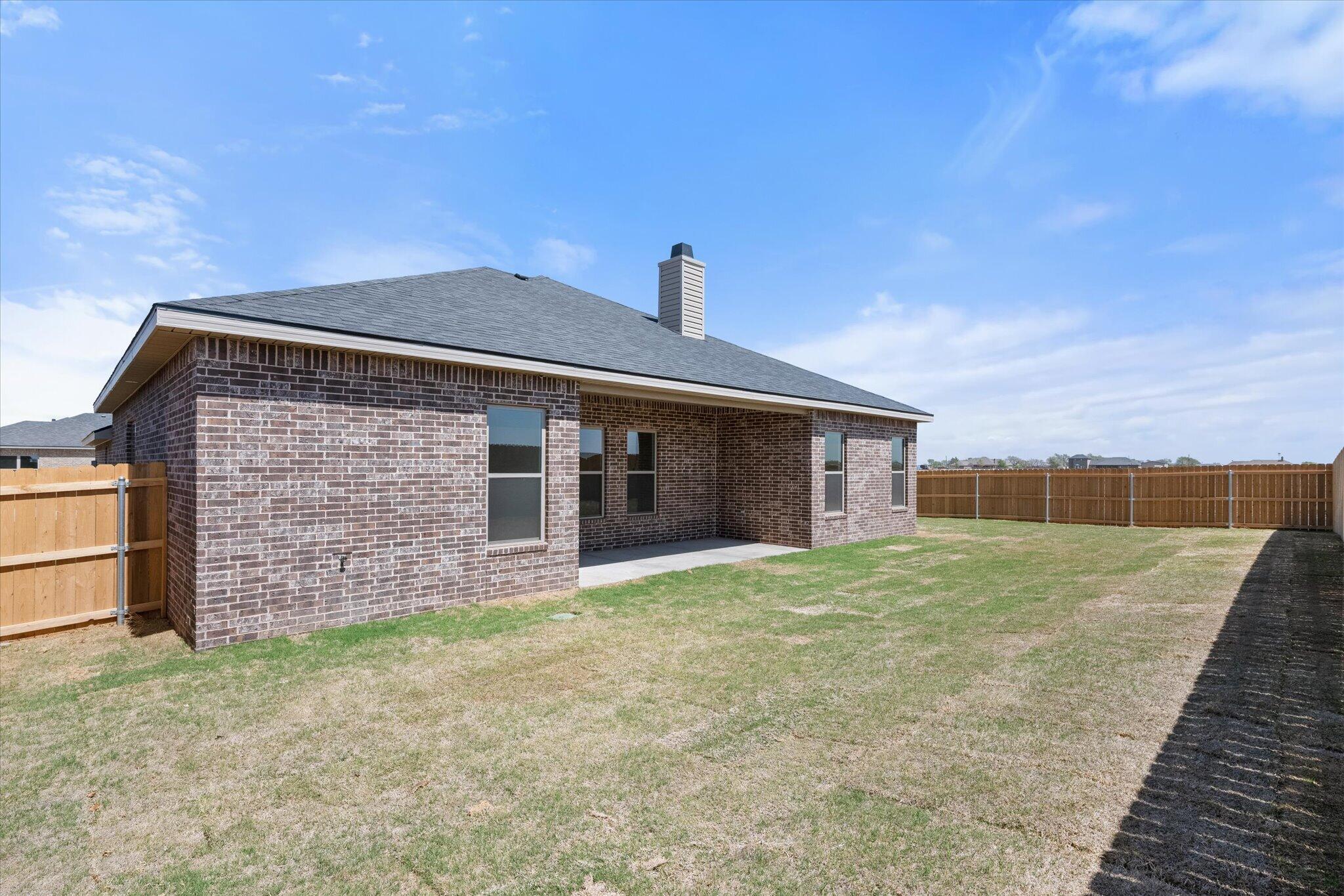 6101 121st Street Lubbock, TX 79424 - Photo 29 of 29 a view of a house with a yard