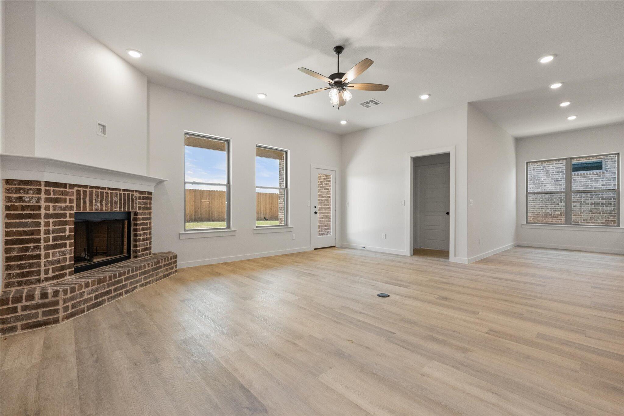 6101 121st Street Lubbock, TX 79424 - Photo 5 of 29 a view of an empty room with window and fire place