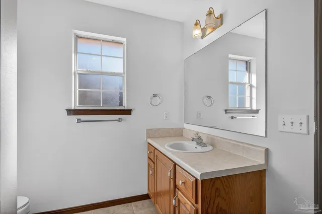 a view of a bathroom from the hallway