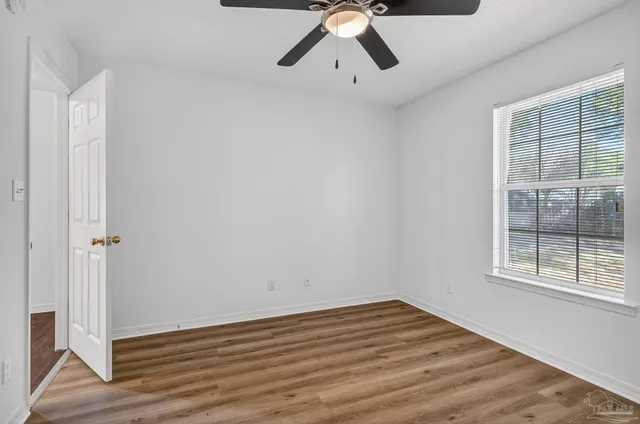 a kitchen with stainless steel appliances granite countertop a sink and a refrigerator