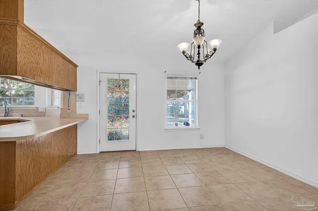 a view of a kitchen with electric appliances