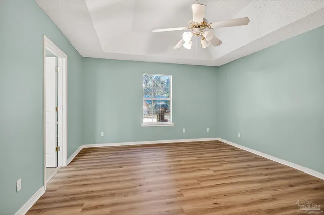 a view of a big room with wooden floor