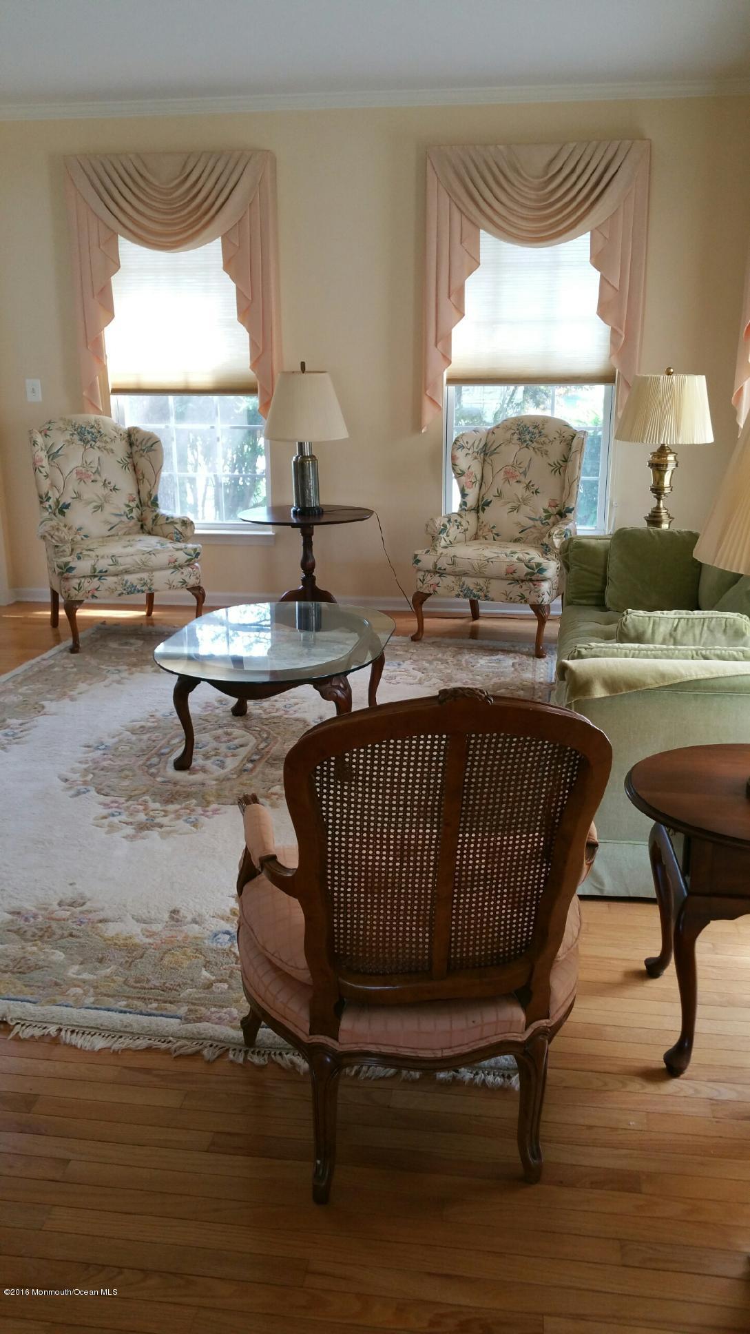 120 Bear Oak Road Freehold, NJ 07728 - Photo 6 of 9 a living room with a table and a window
