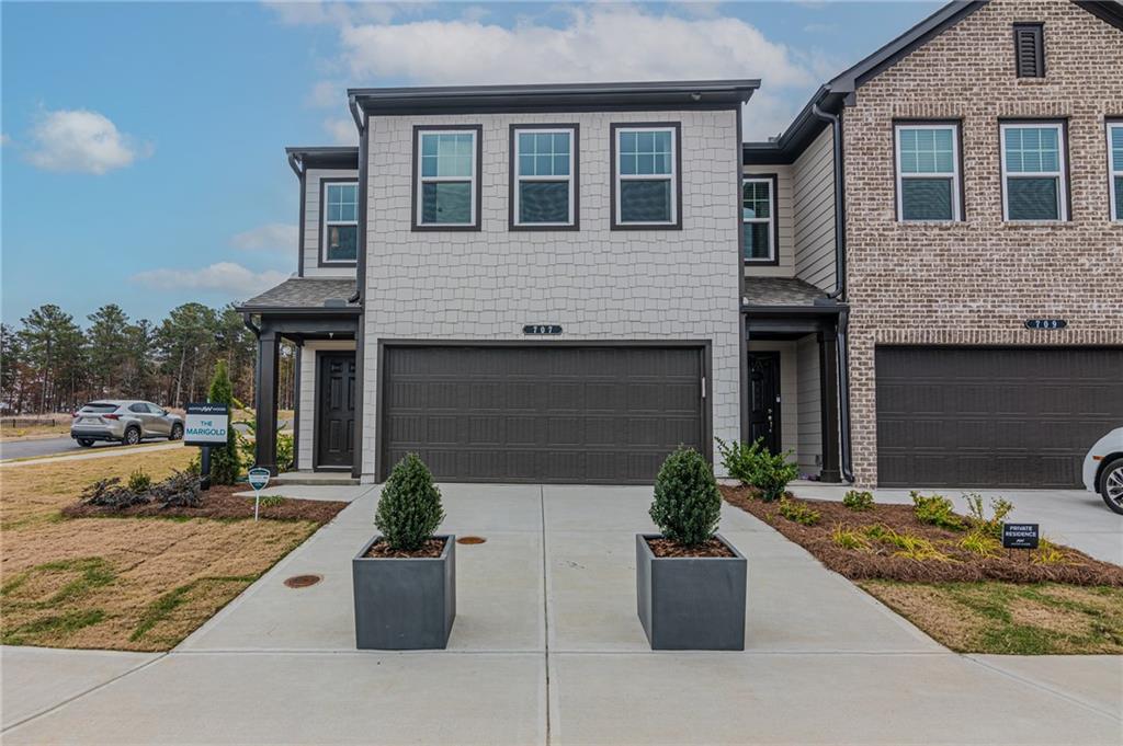 741 Severine Drive Cumming, GA 30041 - Photo 1 of 1 a front view of a house with potted plants