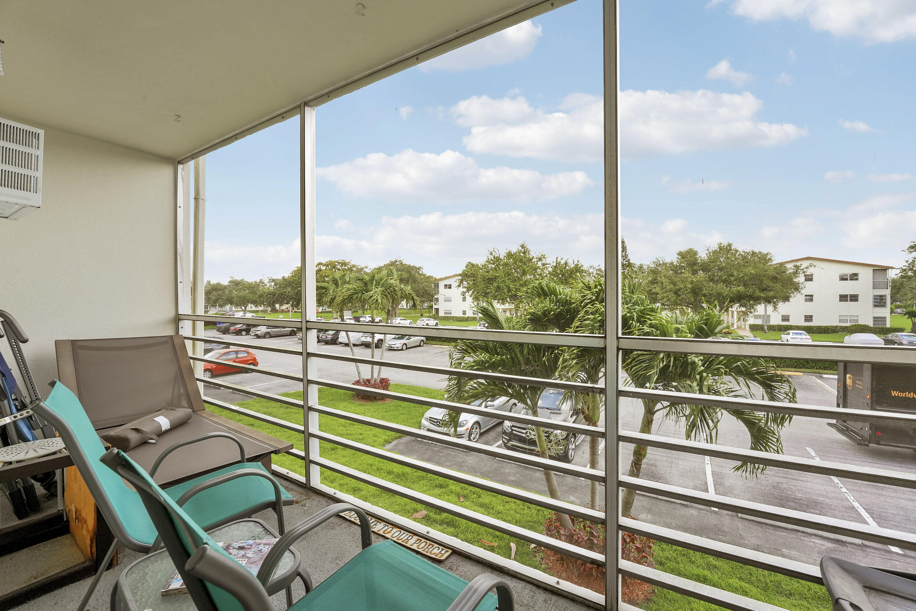 146 Mansfield D Boca Raton, FL 33434 - Photo 12 of 12 a view of a balcony with a table and chairs