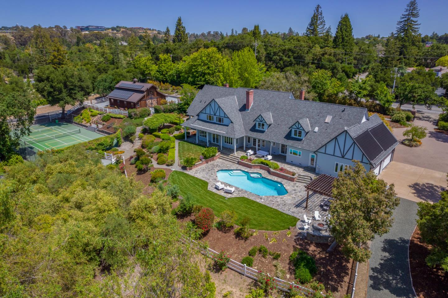 an aerial view of a house with a garden
