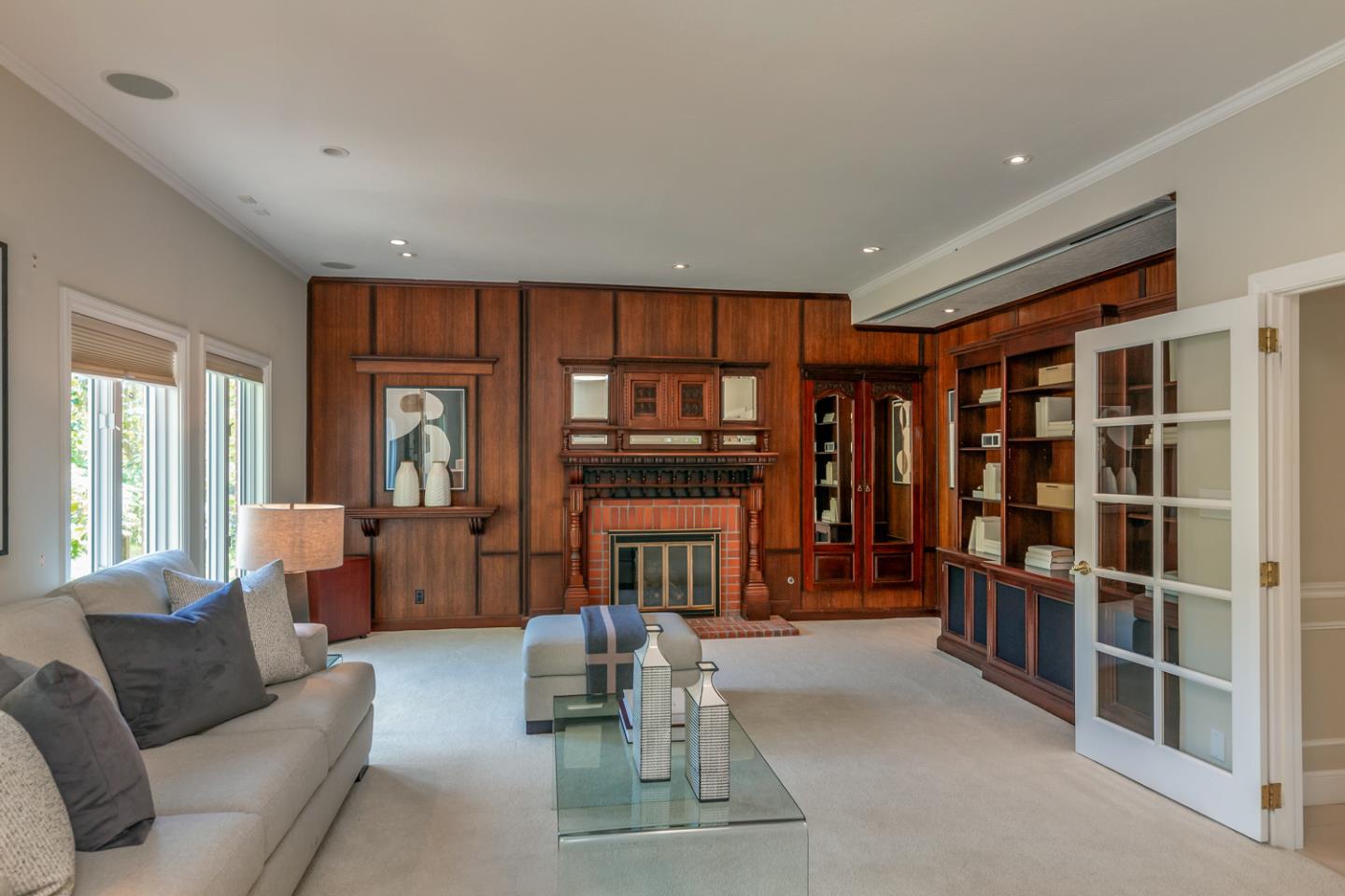1210 Cañada Road Woodside, CA 94062 - Photo 15 of 60 a living room with furniture a fireplace and a flat screen tv