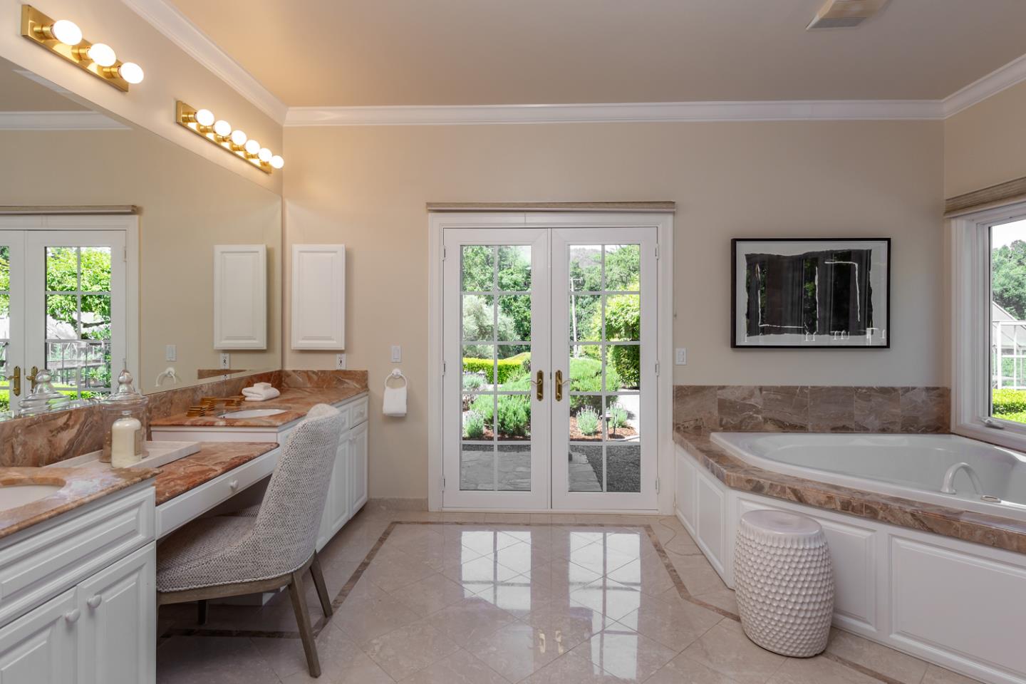 1210 Cañada Road Woodside, CA 94062 - Photo 20 of 60 a spacious bathroom with a granite countertop tub a sink and a large mirror