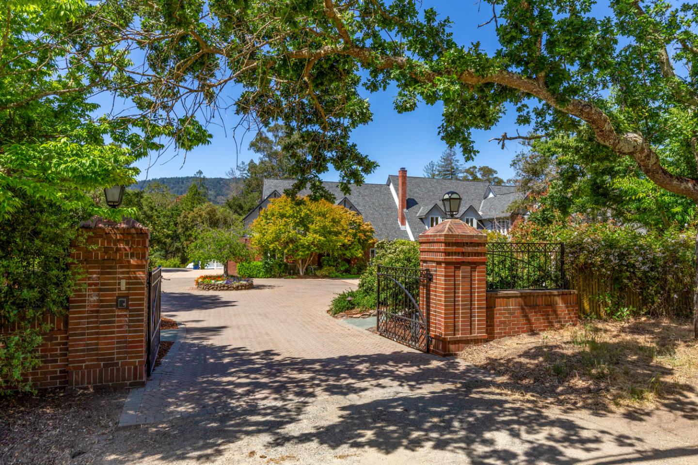 1210 Cañada Road Woodside, CA 94062 - Photo 2 of 60 a backyard of a house with lots of green space