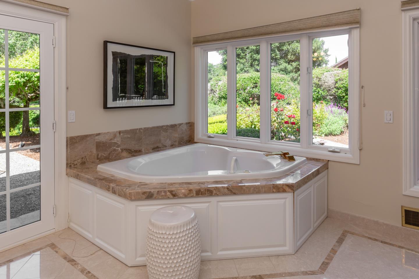 1210 Cañada Road Woodside, CA 94062 - Photo 22 of 60 a bath tub sitting in a bathroom next to a window