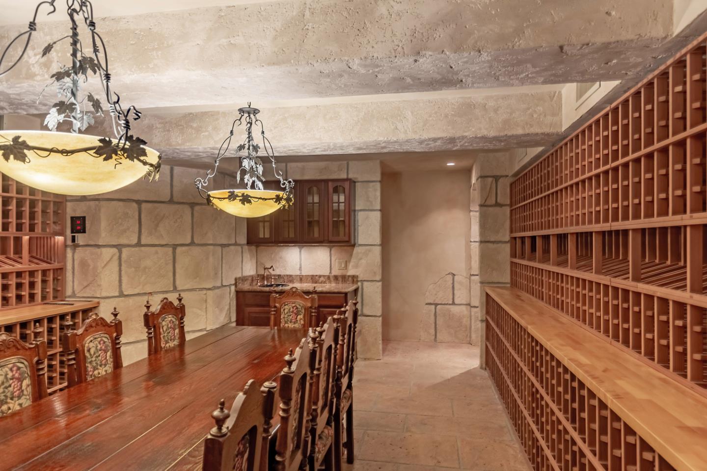 1210 Cañada Road Woodside, CA 94062 - Photo 33 of 60 a dining room with furniture and wooden floor