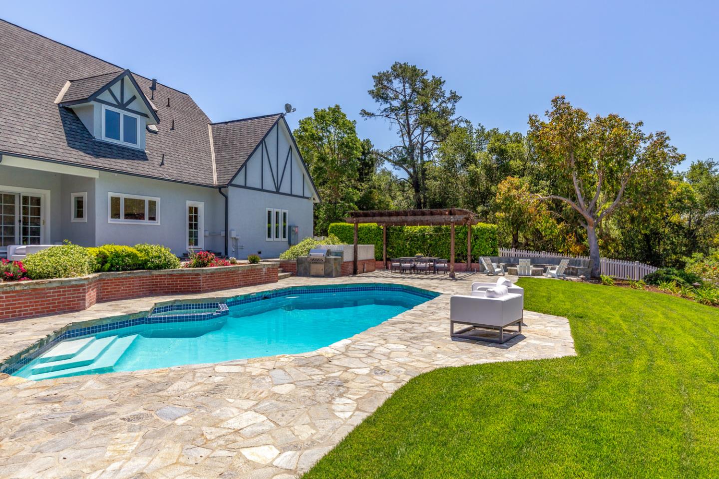 1210 Cañada Road Woodside, CA 94062 - Photo 38 of 60 a view of a house with a yard porch and sitting area