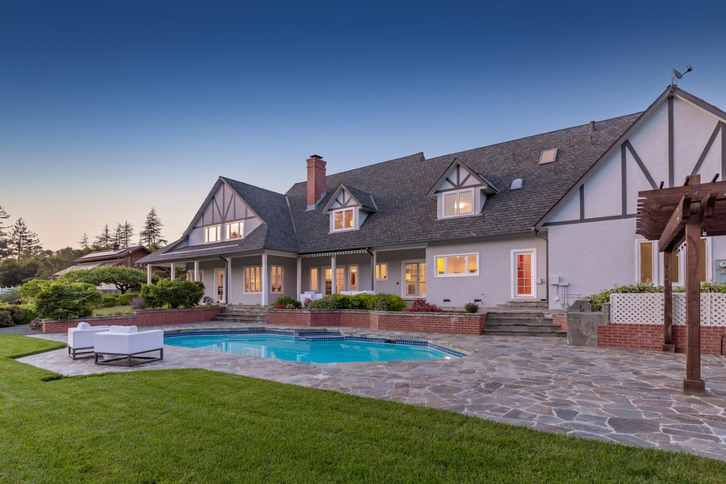 1210 Cañada Road Woodside, CA 94062 - Photo 43 of 60 a front view of a house with garden