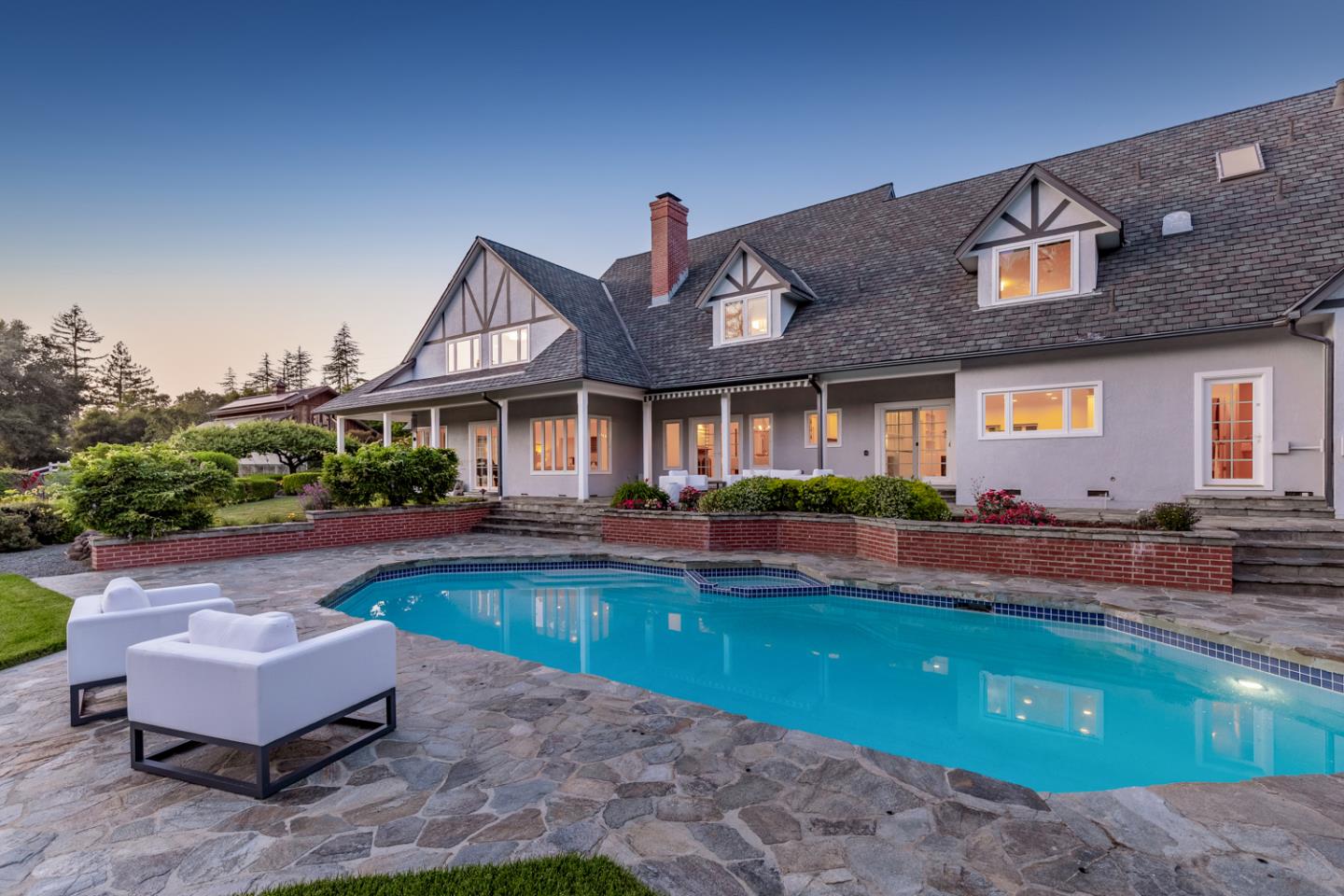 1210 Cañada Road Woodside, CA 94062 - Photo 44 of 60 a front view of house with outdoor space and swimming pool