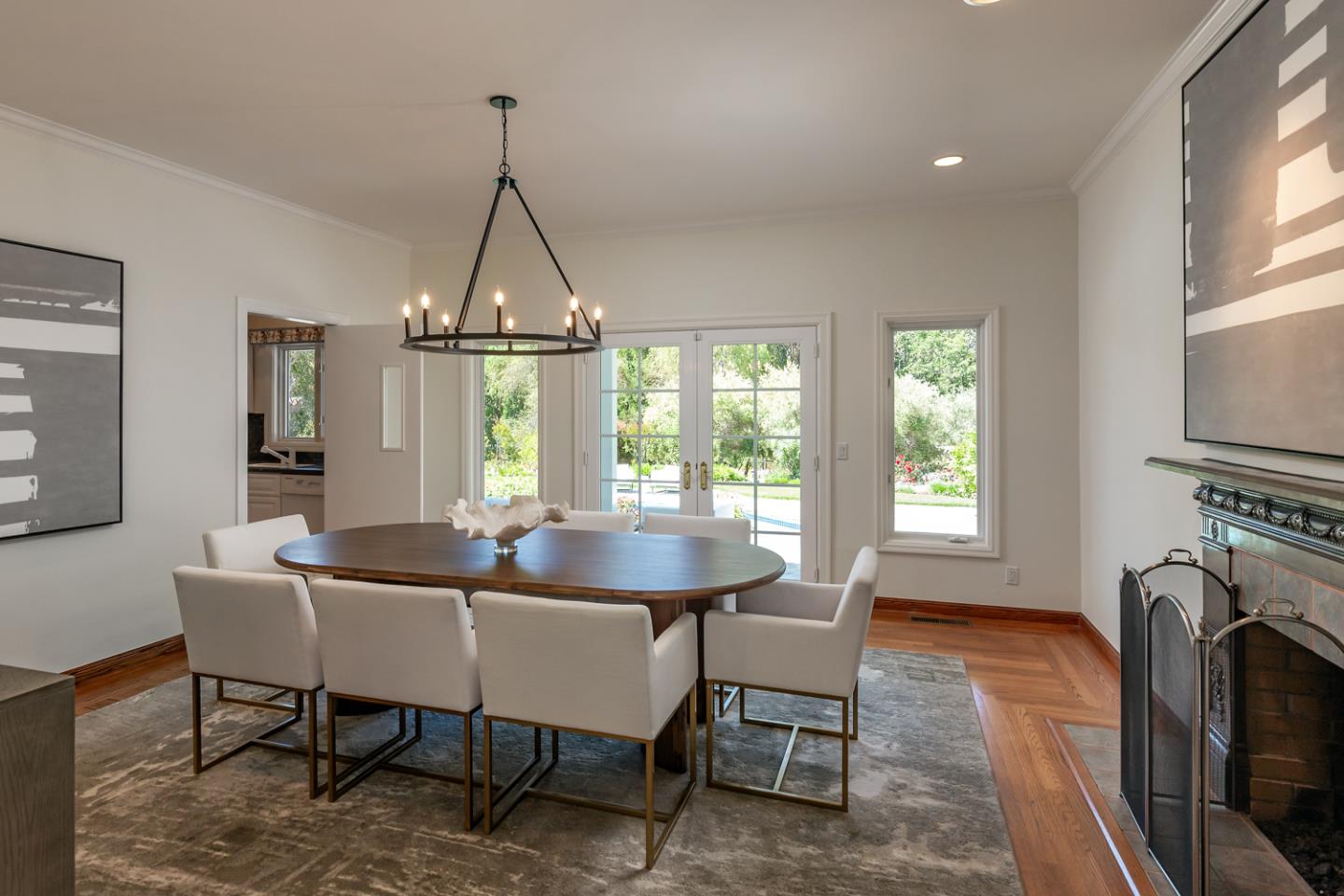 1210 Cañada Road Woodside, CA 94062 - Photo 7 of 60 a dining room with furniture a chandelier and wooden floor