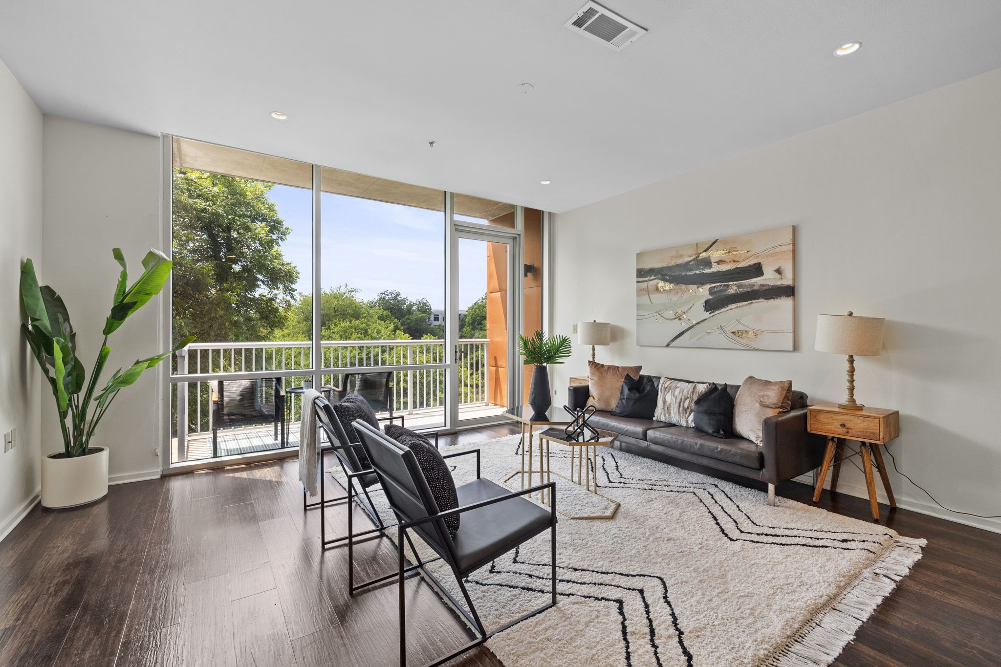 1600 Barton Springs Road, Unit 5410 Austin, TX 78704 - Photo 1 of 1 The living area is very spacious with hardwood flooring and ample natural light.