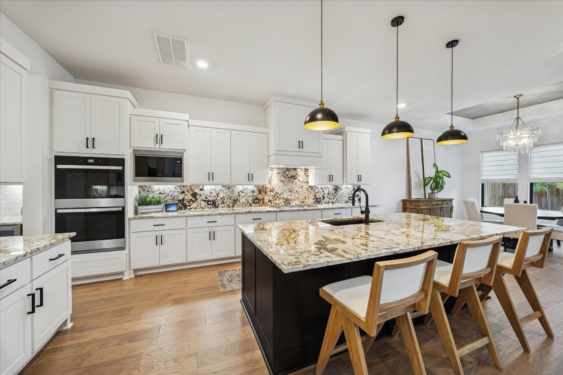 4118 Pleasant Ridge Drive Spring, TX 77386 - Photo 20 of 50 Your Gourmet Kitchen features double ovens, gas cooktop, a built-in microwave & dishwasher. Plenty of cabinet space in addition to your walk-in pantry.