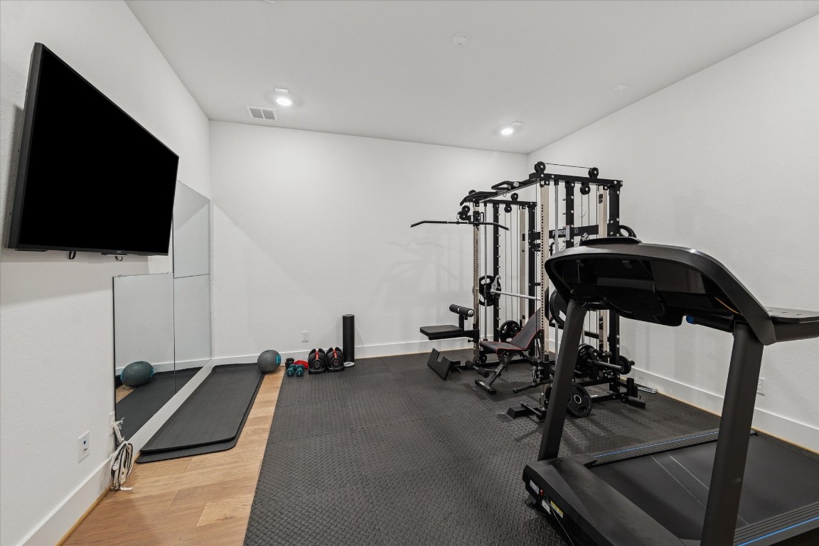 4118 Pleasant Ridge Drive Spring, TX 77386 - Photo 26 of 50 FLEX ROOM currently being used as a Home Gym. It is Pre-Wired for sound and can be easily turned into a Movie Theater in addition to the Gameroom on the 2nd Floor.