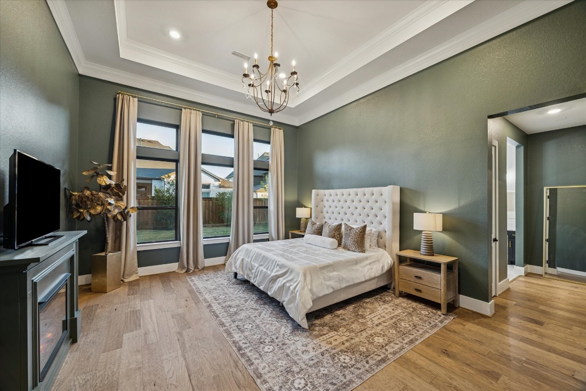 4118 Pleasant Ridge Drive Spring, TX 77386 - Photo 27 of 50 *EXTENDED* Primary Bedroom with Vaulted Ceilings, recessed lighting, high-end curtains & Chandelier.