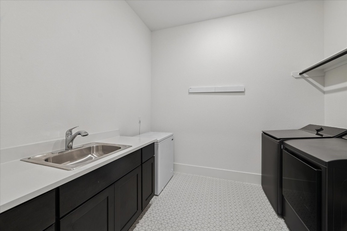 4118 Pleasant Ridge Drive Spring, TX 77386 - Photo 42 of 50 Your LARGE Laundry Room is off your SECOND Garage and has an upgraded Sink. There is also enough space to add an additional Fridge/Freezer if desired