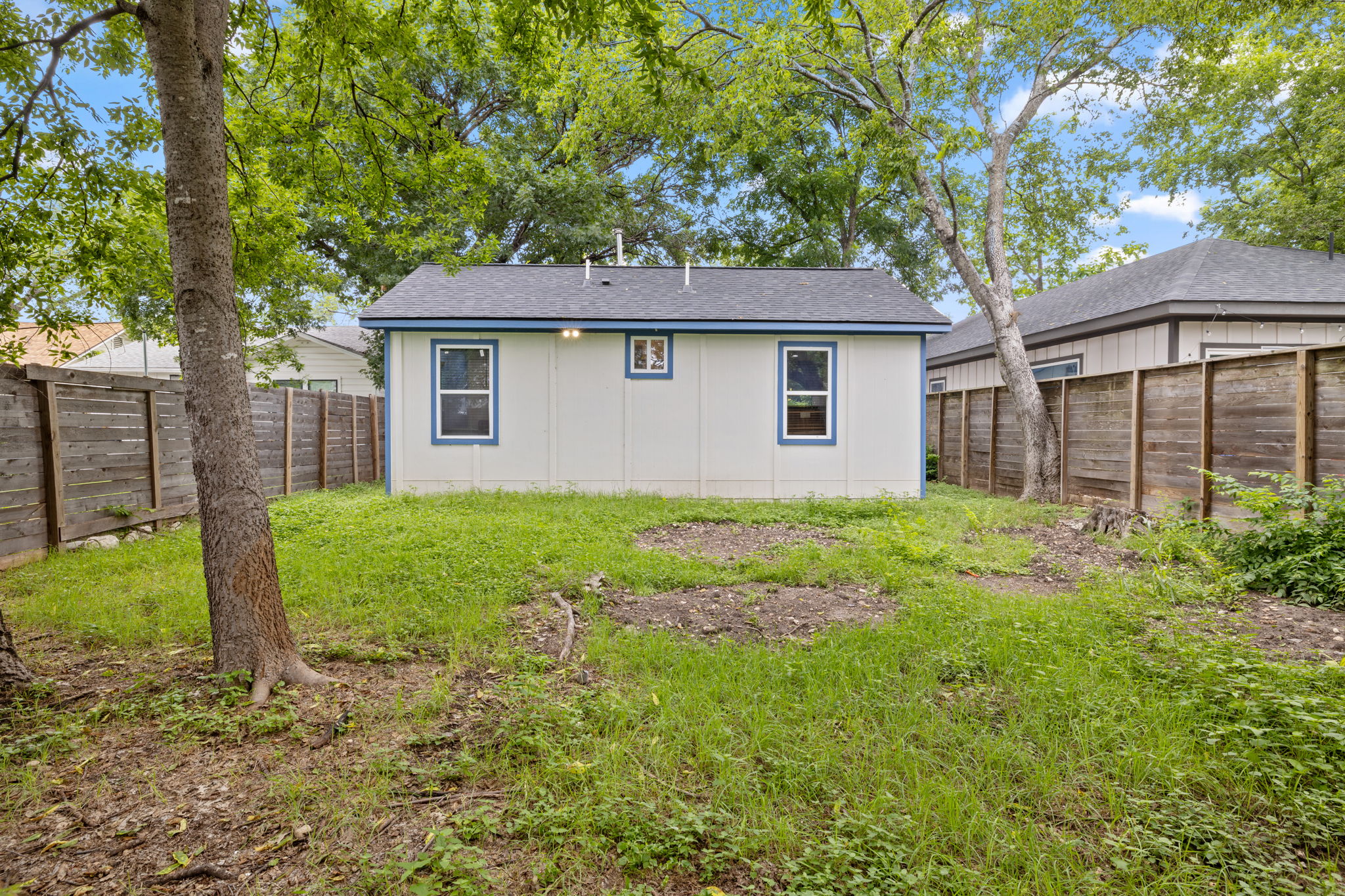 907 East 53rd Street Austin, TX 78751 - Photo 34 of 36 A private, fenced backyard offers verdant surroundings and ample outdoor living space.