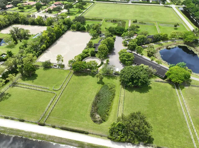 a view of a lake with a house in the background