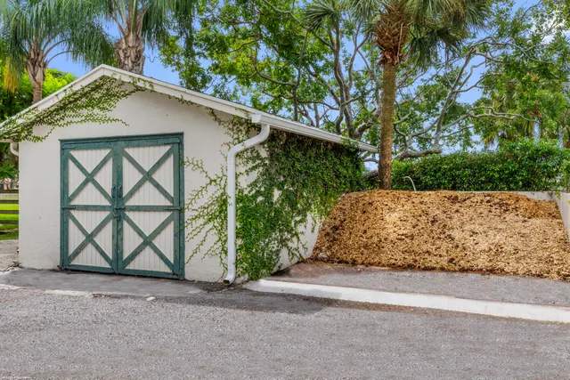 a view of a house with pool and tree s