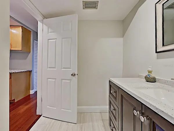 a bathroom with a sink a vanity and a mirror