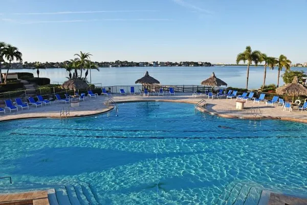 a view of swimming pool with outdoor seating
