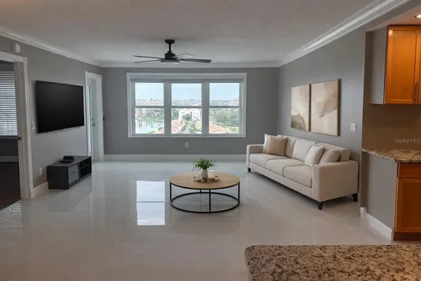 a living room with furniture and a flat screen tv