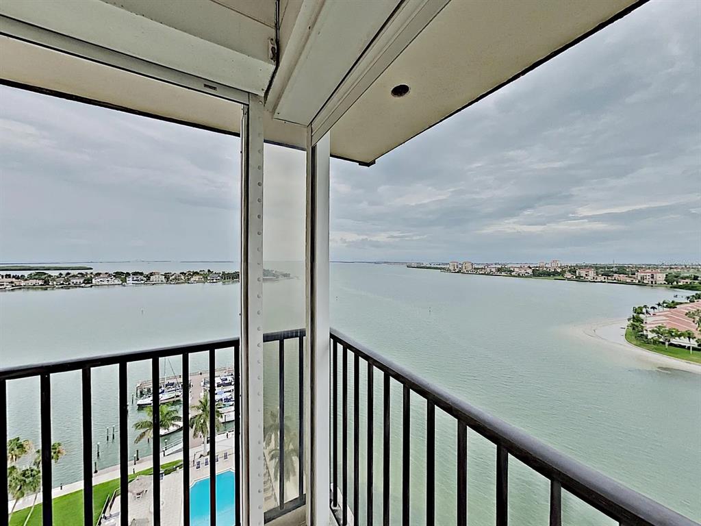 5220 Brittany Drive South, Unit 1502 St. Petersburg, FL 33715 - Photo 8 of 21 a view of a balcony with wooden floor
