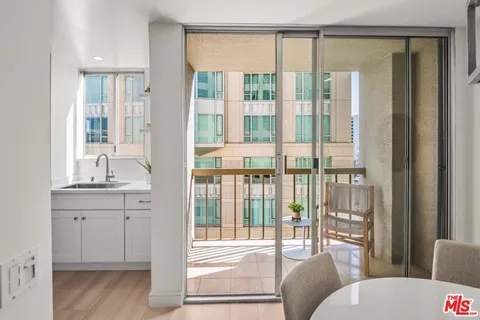 a spacious bathroom with a double vanity sink and mirror